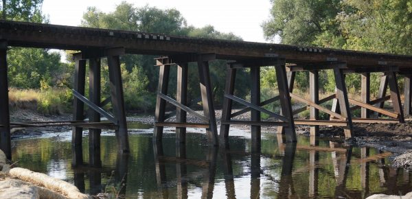 View of a bridge on the Cache la Poudre River, for Here Song: Sound compositions to map the land, 2022