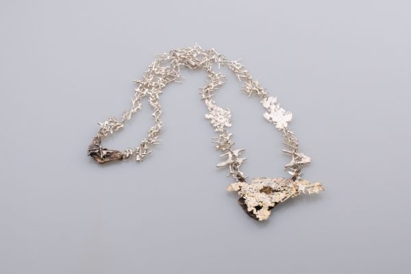 A art necklace made of silver, bronze and amethyst